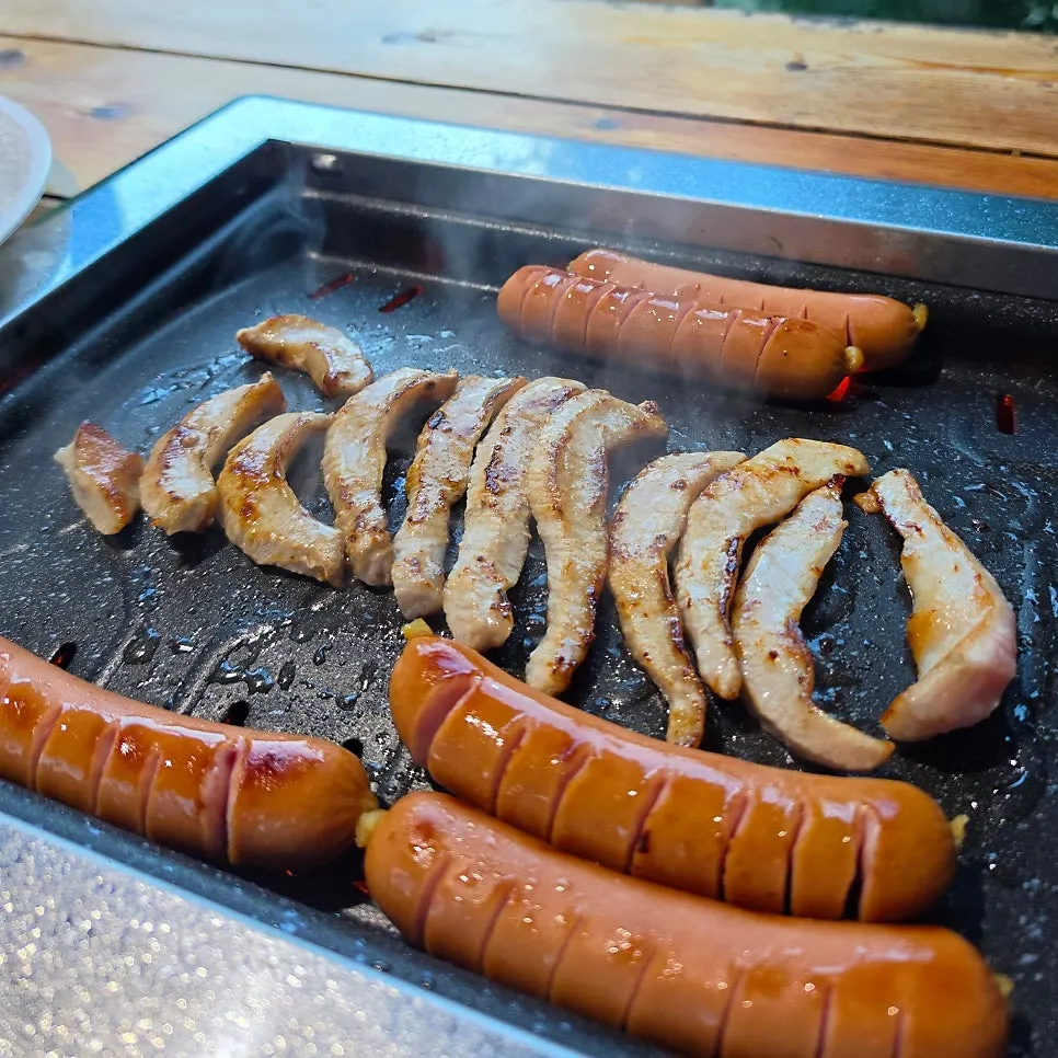 Pork jowl and sausage laid out sashimi-style