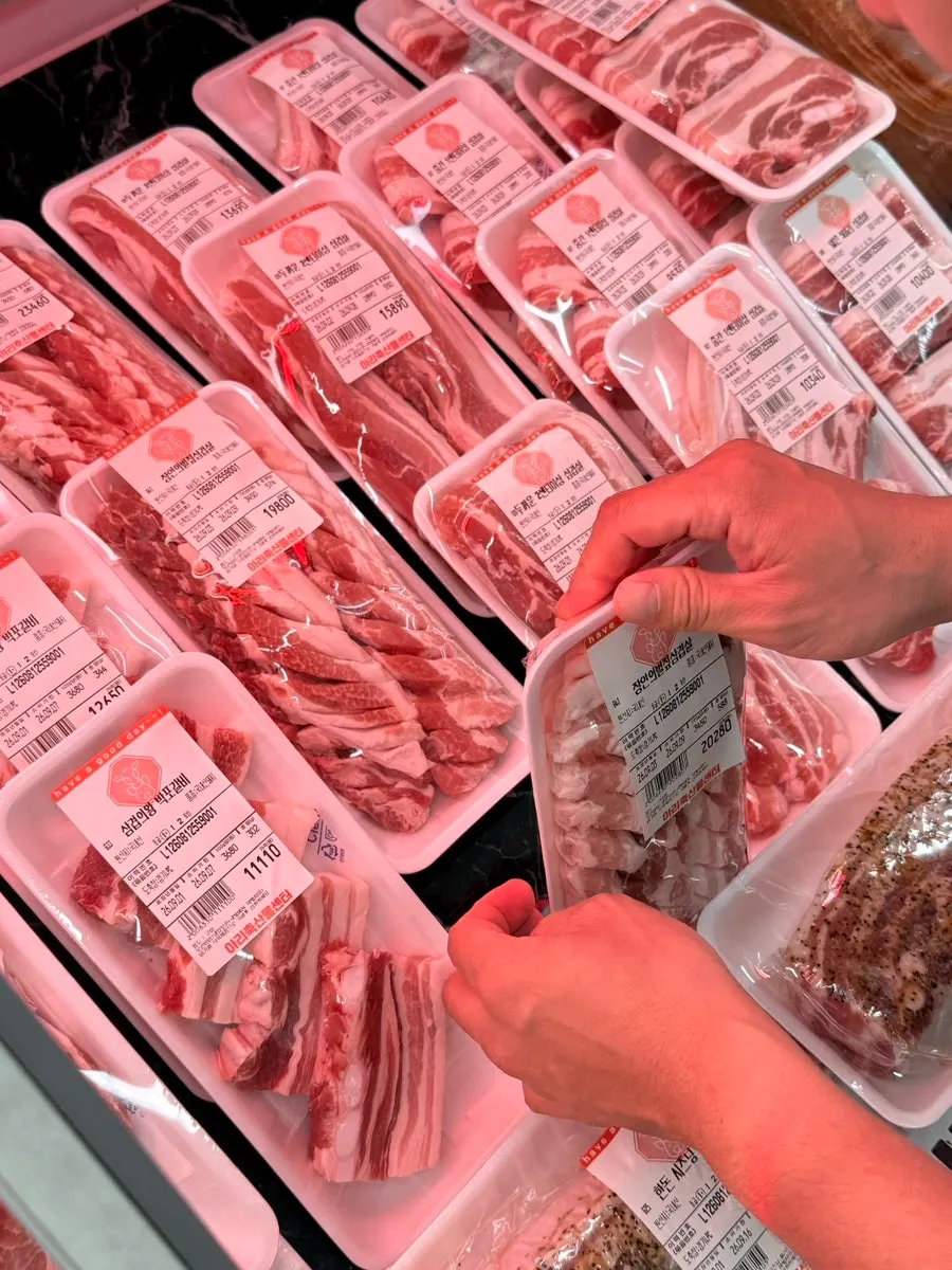 Pork belly and sausages packaged by thickness