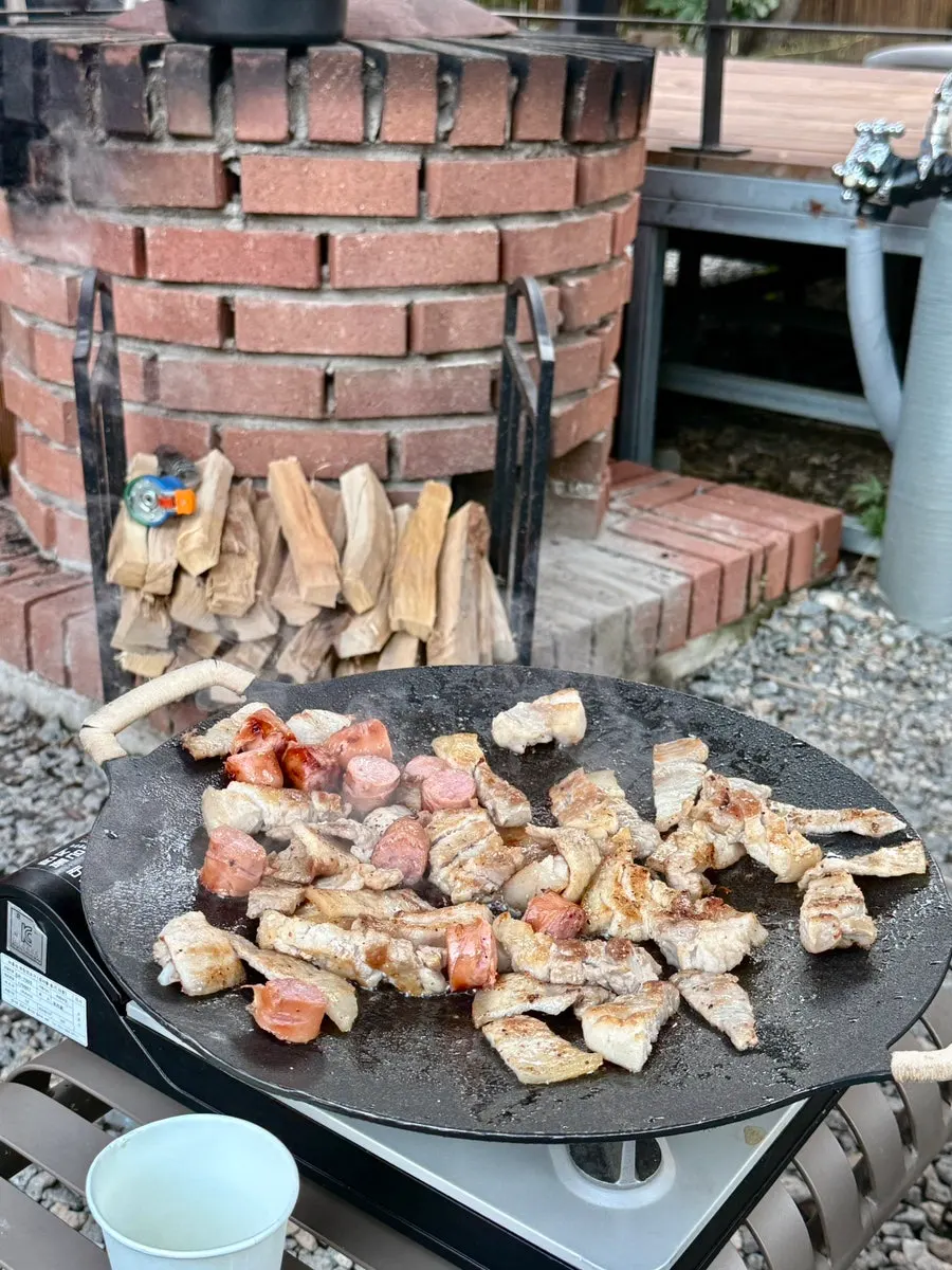 A full barbecue spread set on the pension table