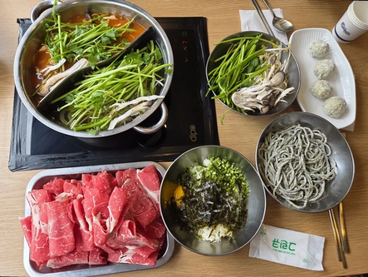 Table spread of half-and-half shabu-shabu for three and meatball dumplings