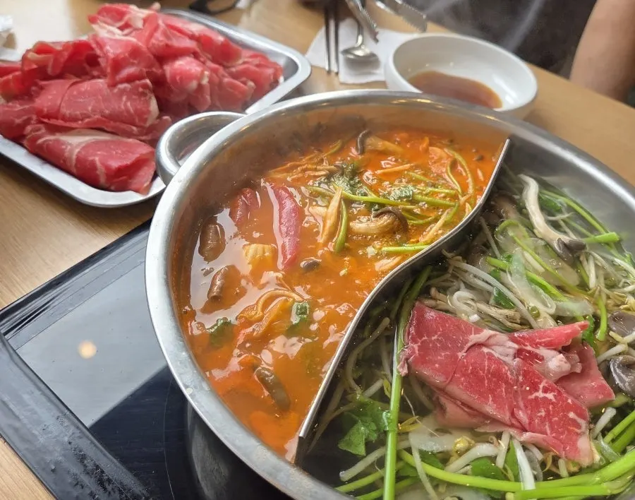Half-and-half pot split between spicy and clear broth