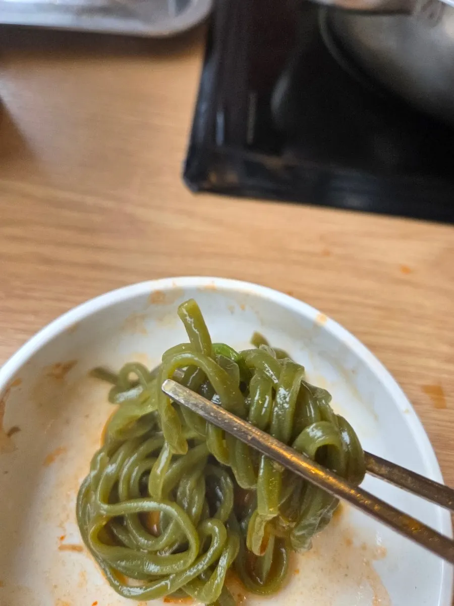 Kalguksu noodles boiling in the broth