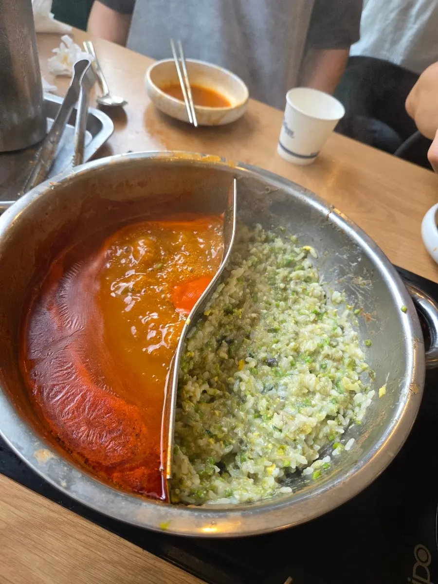 Congee being made with the clear broth