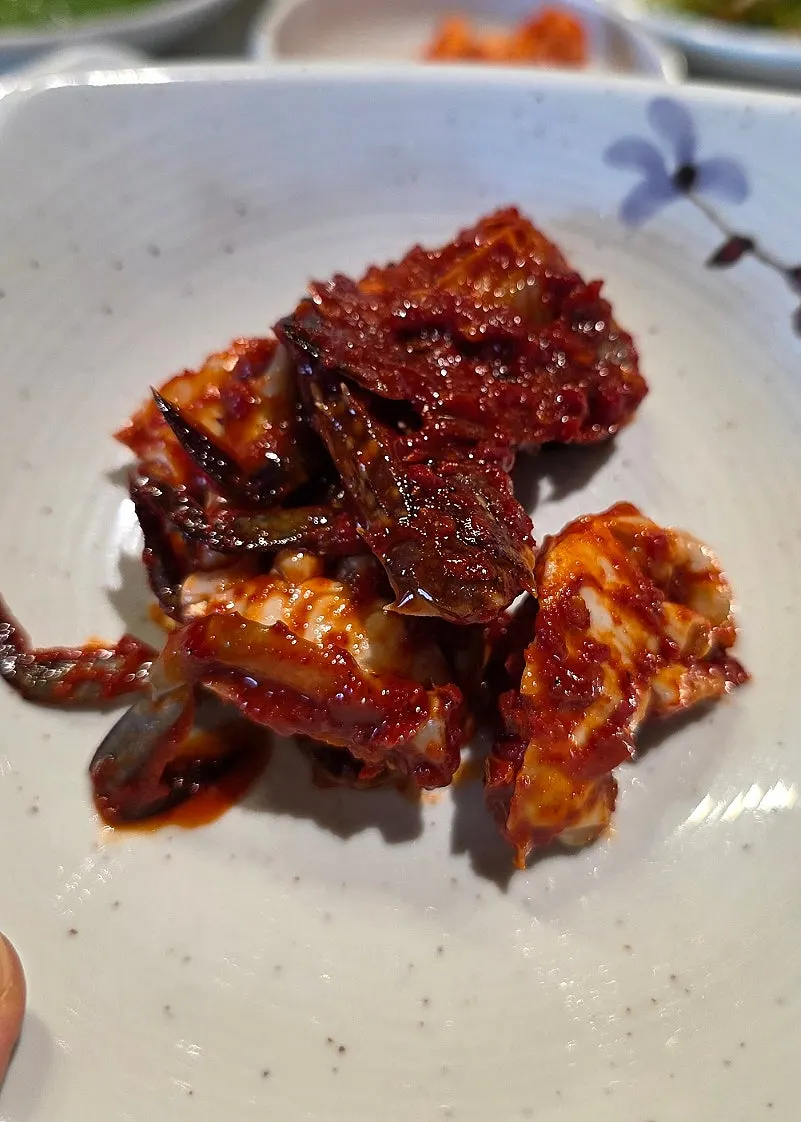 Picking up a piece of grilled pork belly