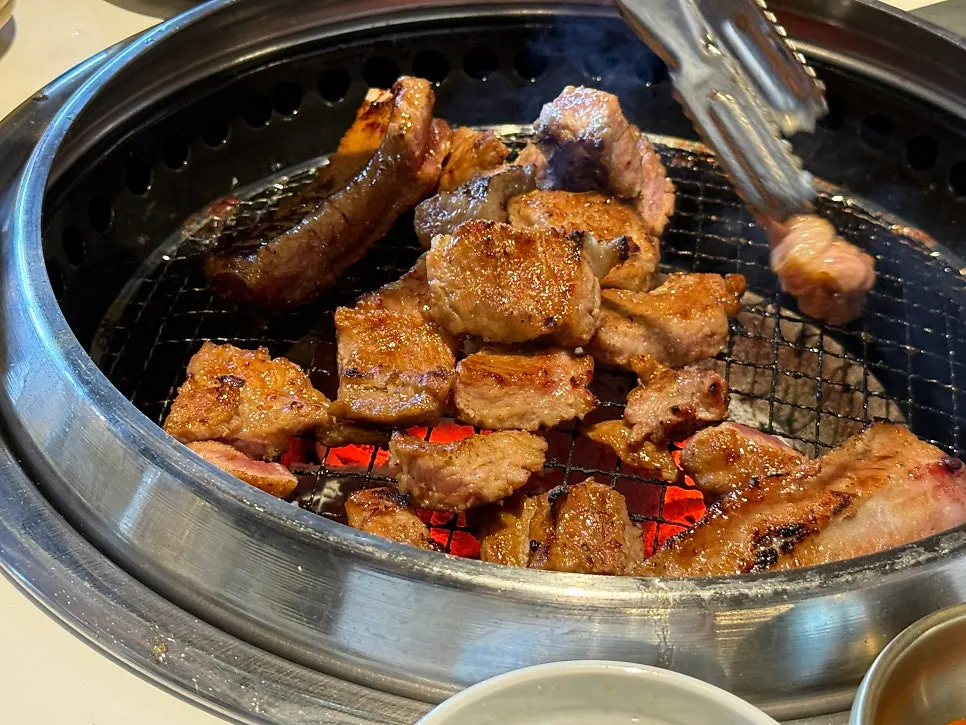 Picking up a piece of grilled pork ribs