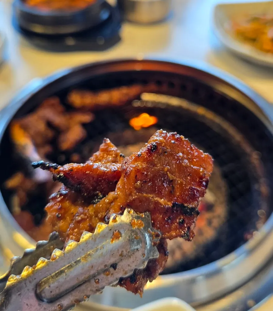 A piece of pork rib with green onion kimchi