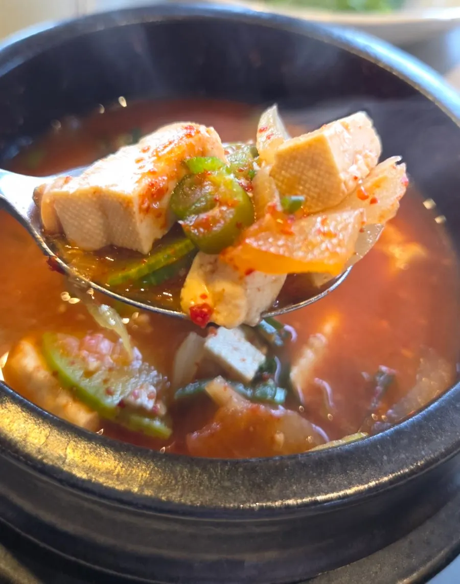 A full bowl of rice with rich doenjang jjigae