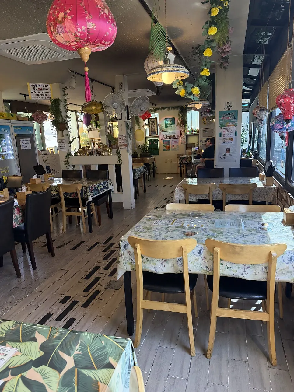 Four-person tables inside Cheongsapo Rice Noodles
