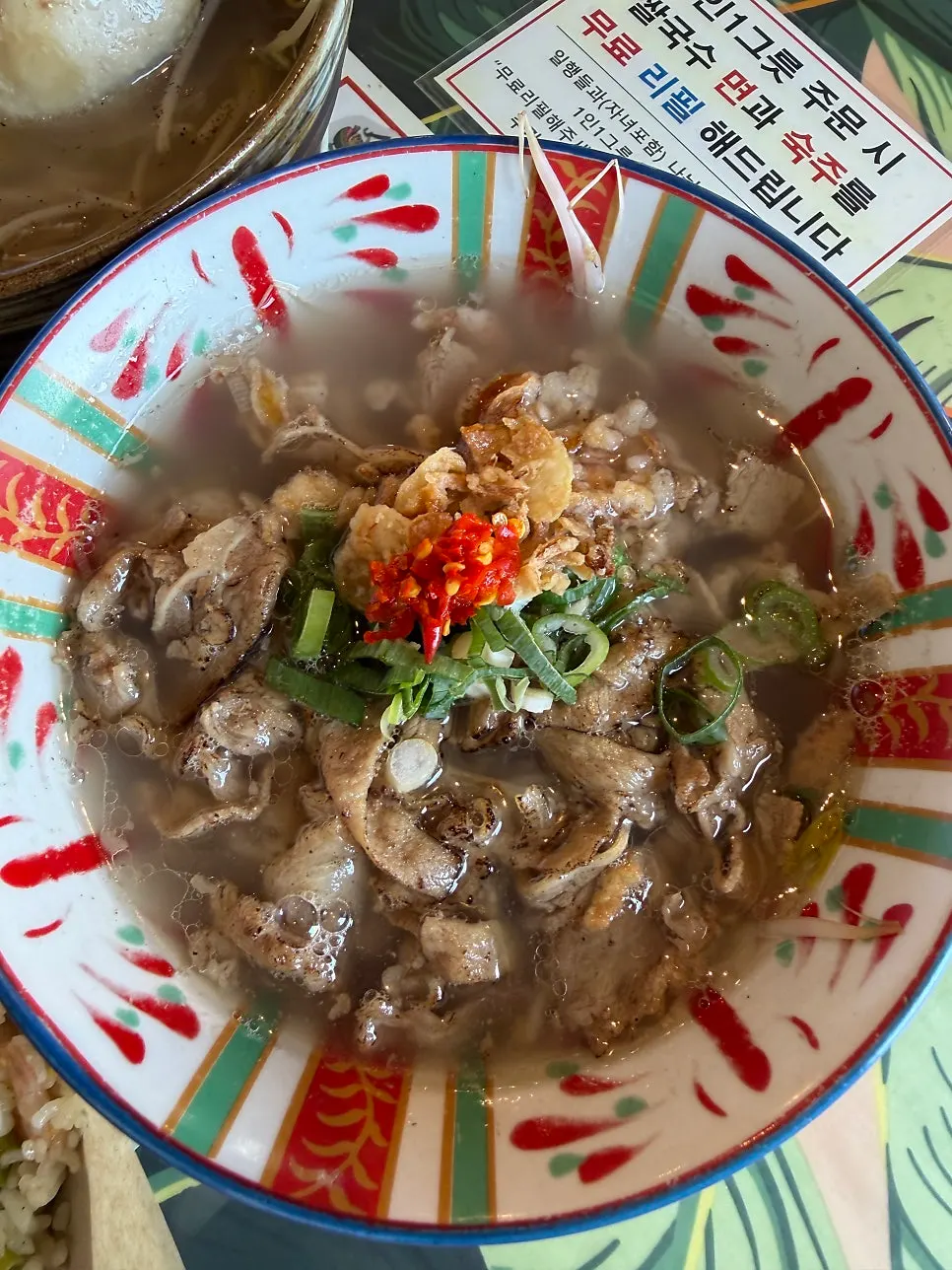 Close-up of the rich broth in the beef pho
