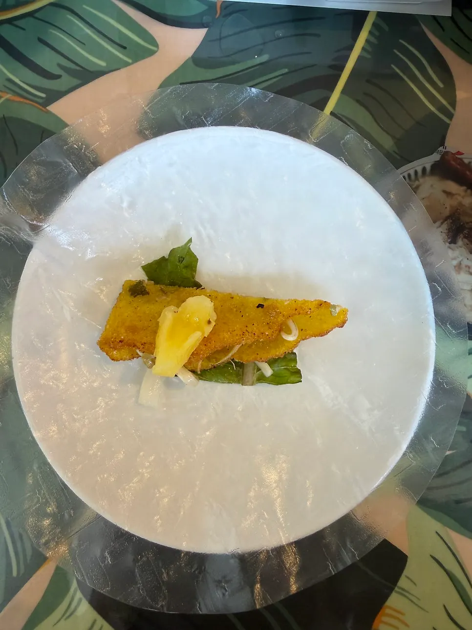 Banh xeo served with rice paper and vegetables