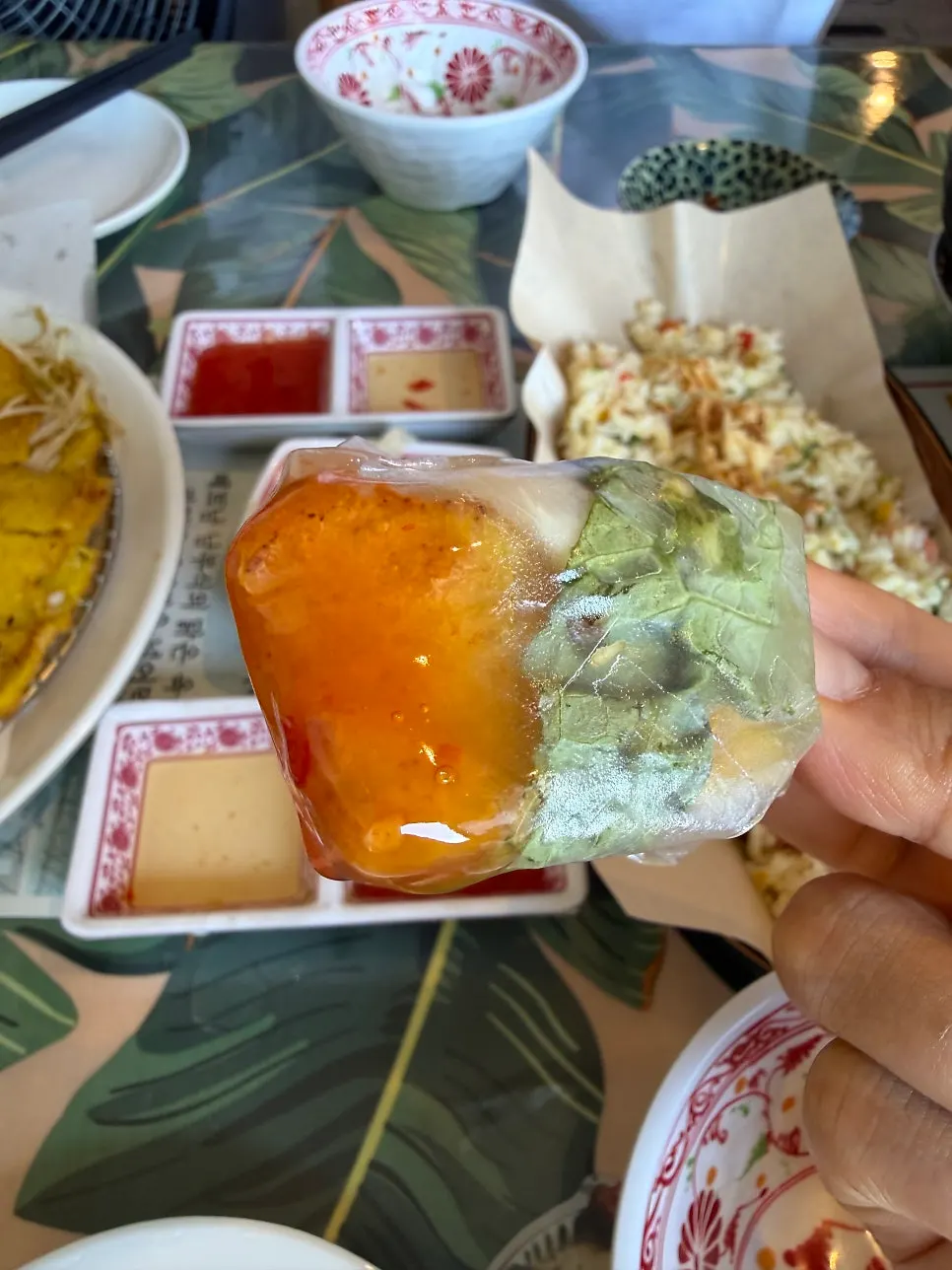 Wrapping banh xeo in rice paper