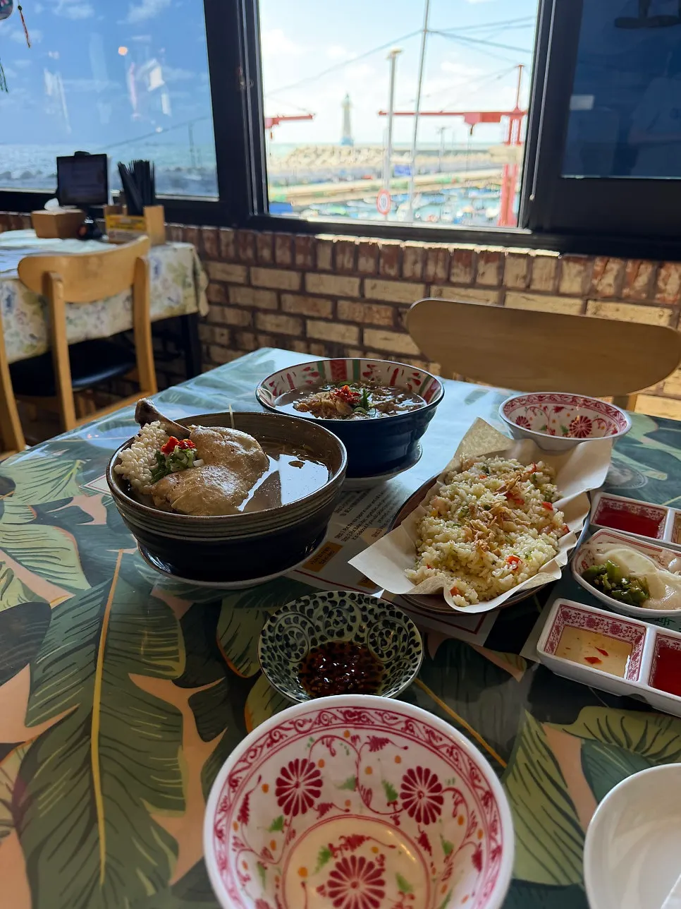 Table set with pho, fried rice, and banh xeo