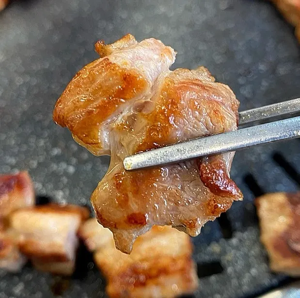 A piece of pork rib topped with salted pollock roe
