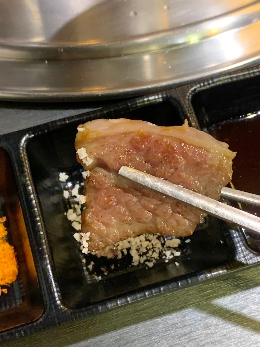 LA-style fresh flower short ribs being torch-seared