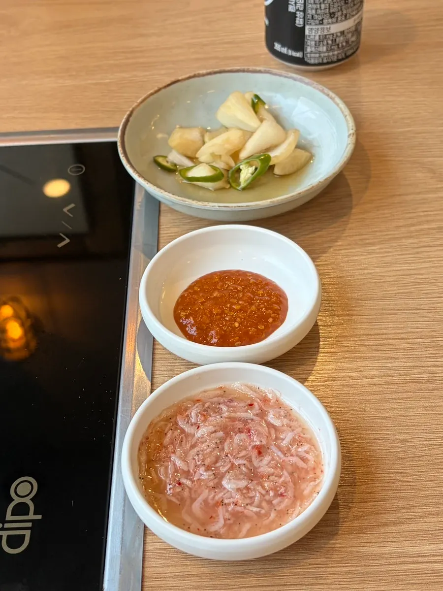 Bossam kimchi, cabbage, and ssamjang side dishes