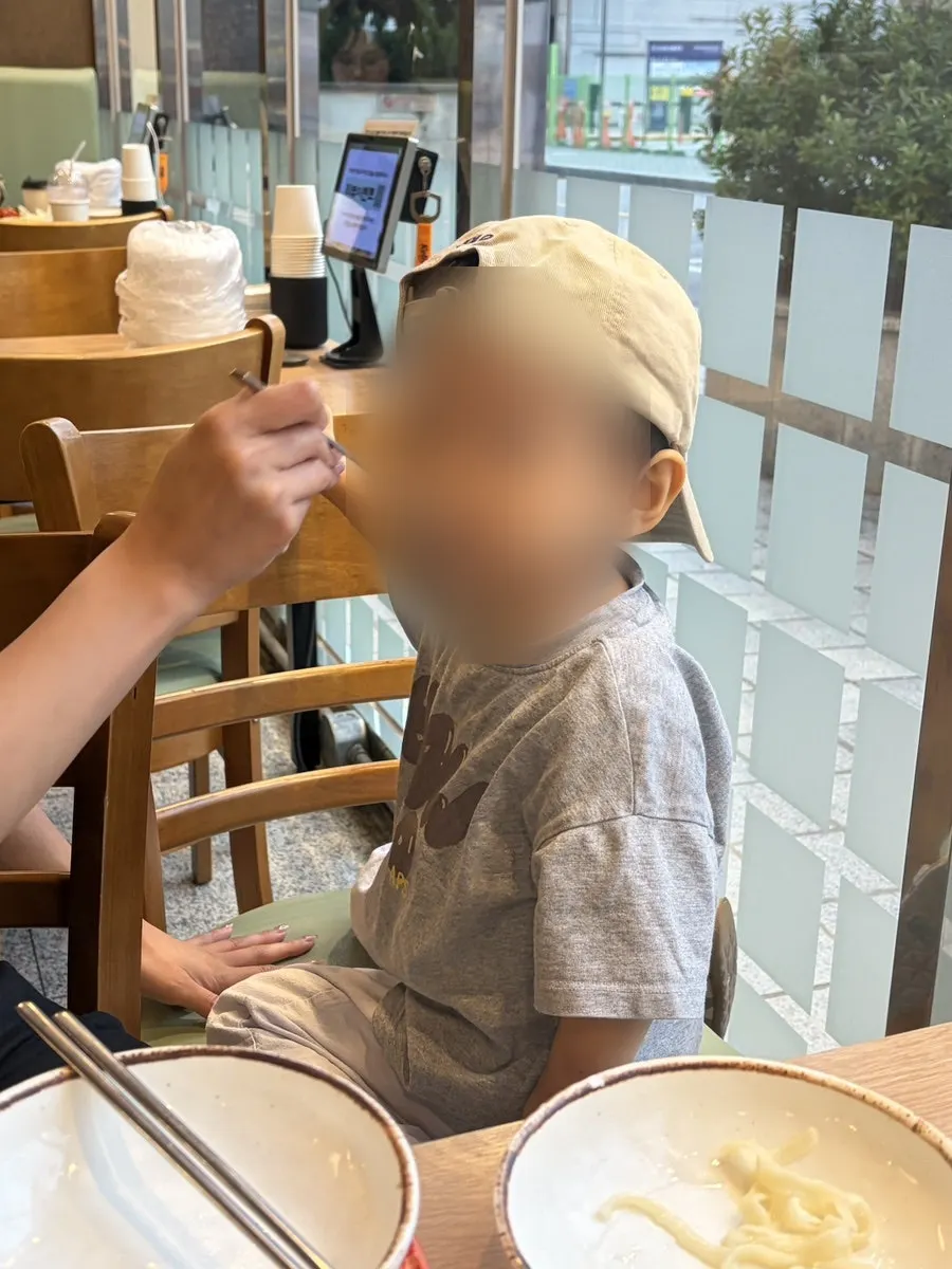Dinner table with bossam shared with a baby