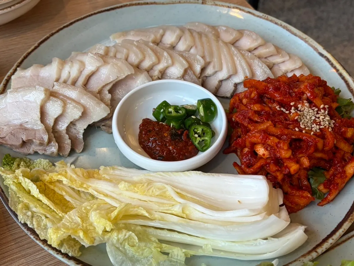 Full table spread of the ogyeop bossam set at Cheongun Bossam Dangsan Branch