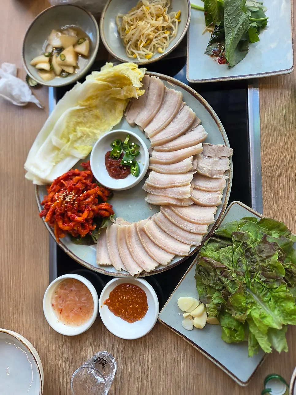 Ohgyeop bossam plated on a round dish