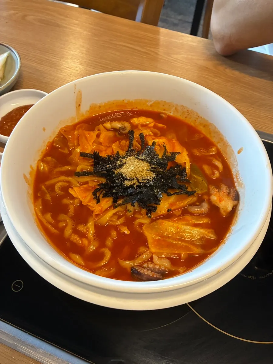 A bowl of rich, spicy kalguksu