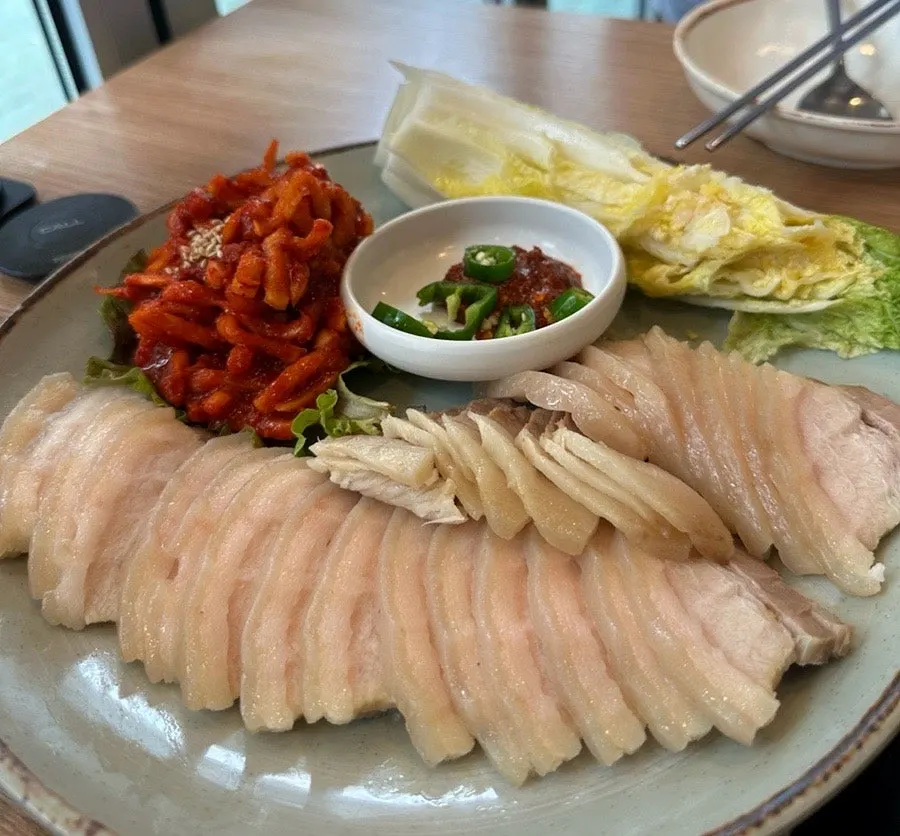 Pork belly bossam and basic side dishes laid out on the table
