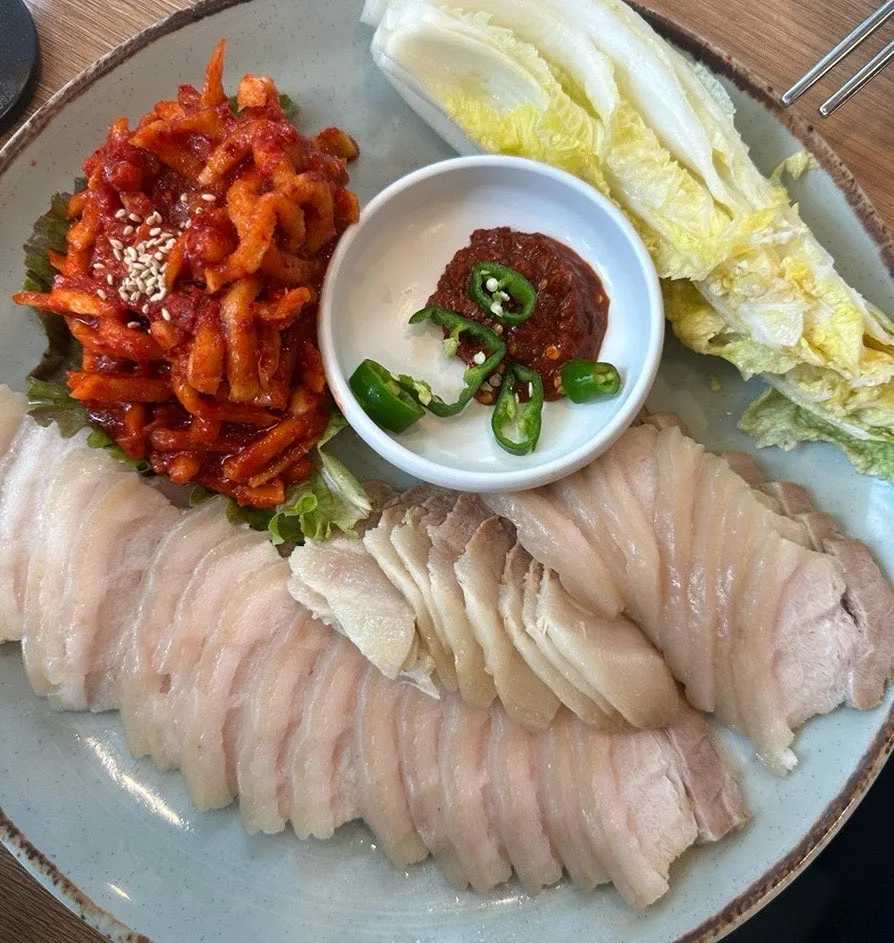 A plate of boiled pork belly bossam
