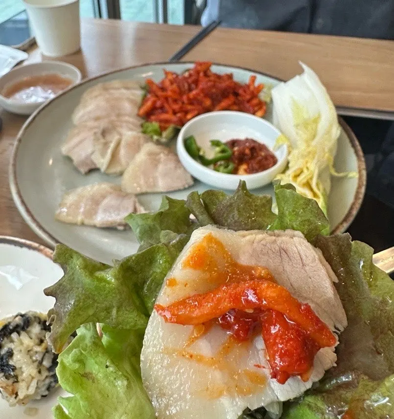 Clam kalguksu noodles and broth served in a bowl