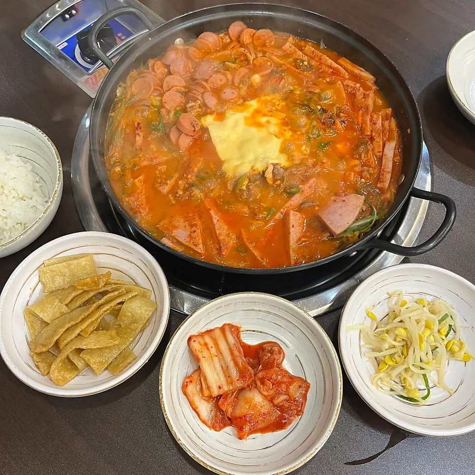 Table set with two servings of Cheongwon budae-jjigae