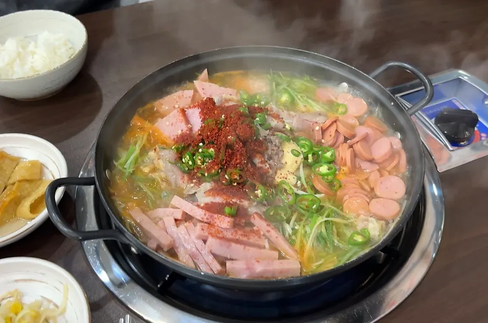 Cheongwon budae-jjigae bubbling as it cooks