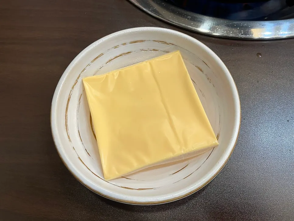 Pot combining ham, sausage, and cheese