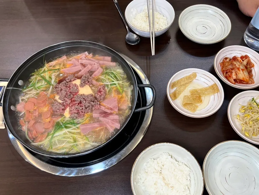 Staff stirring the pot of Songtan budae-jjigae