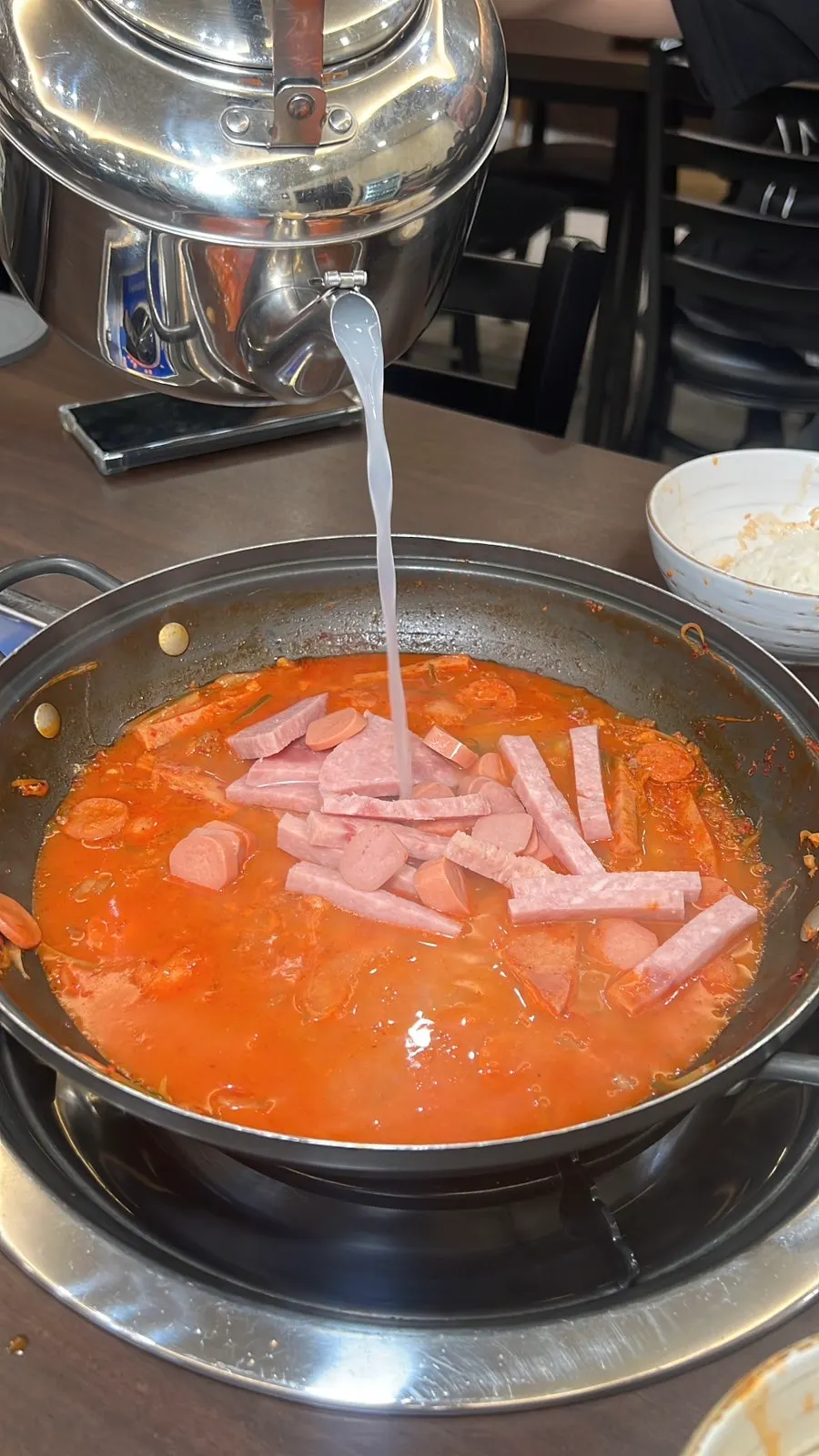 Half-emptied pot of budae-jjigae