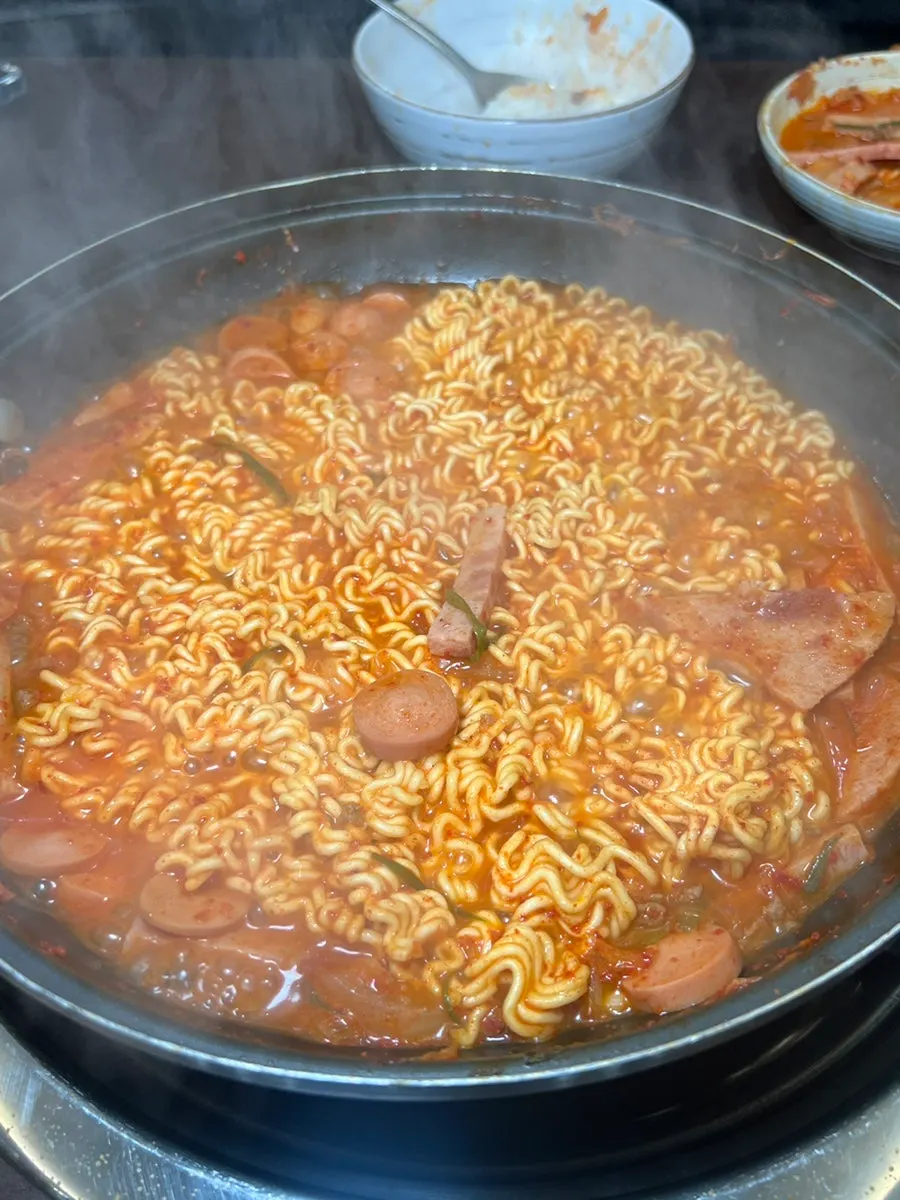 Ramyeon noodle budae-jjigae topped with cheese