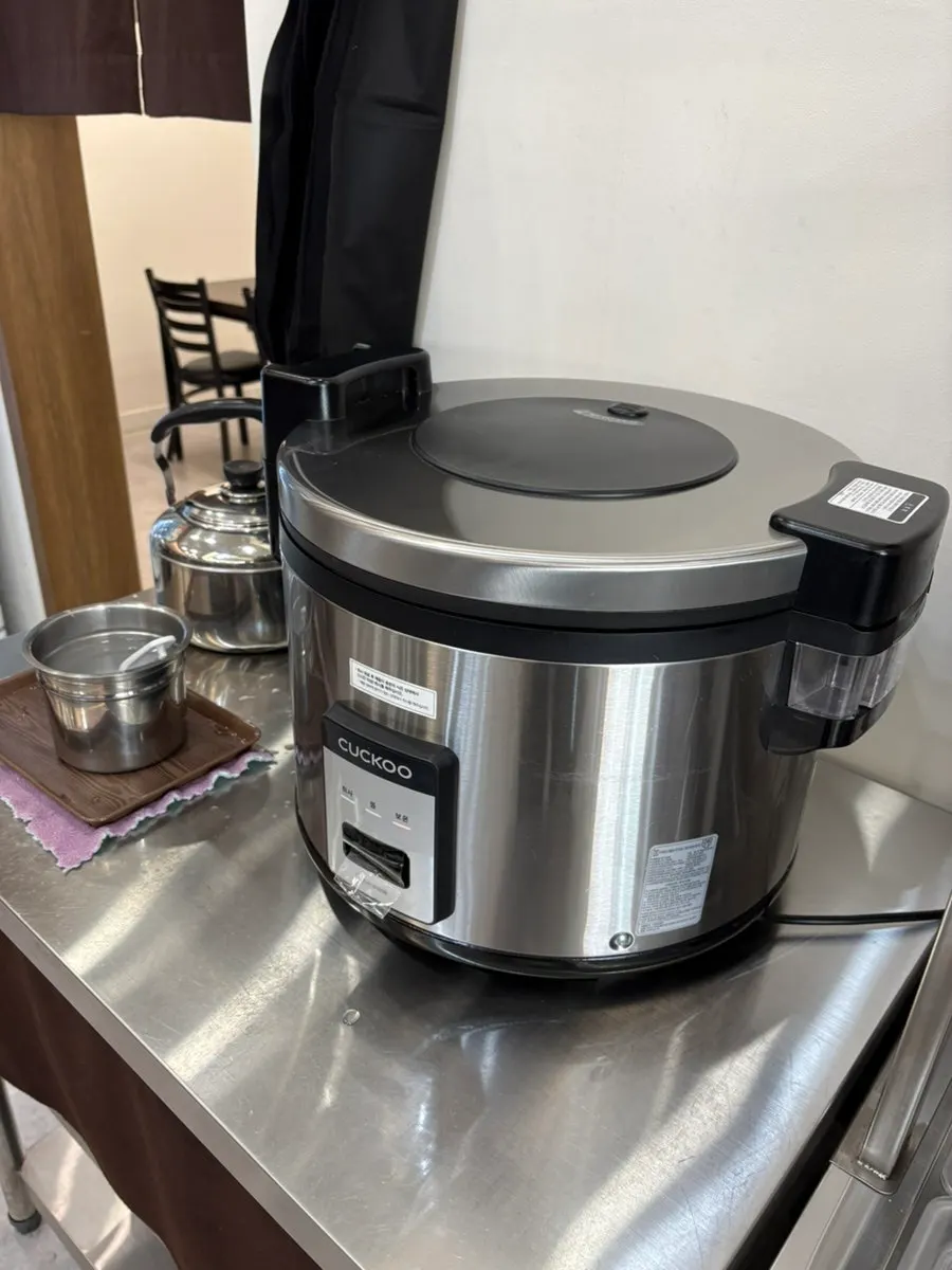 Self-serve corner for free-refill rice and ramen sari