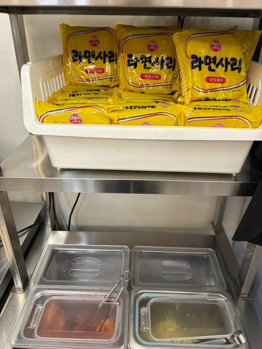 Side dish containers set out at the self-serve bar