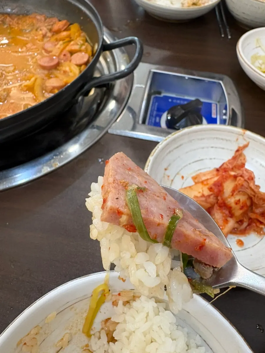 A bowl of budae-jjigae scooped up with broth