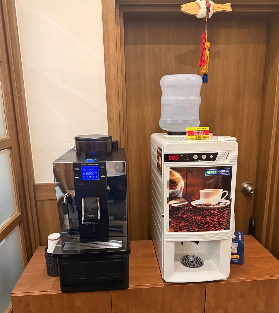 Coffee machine to the right of the entrance