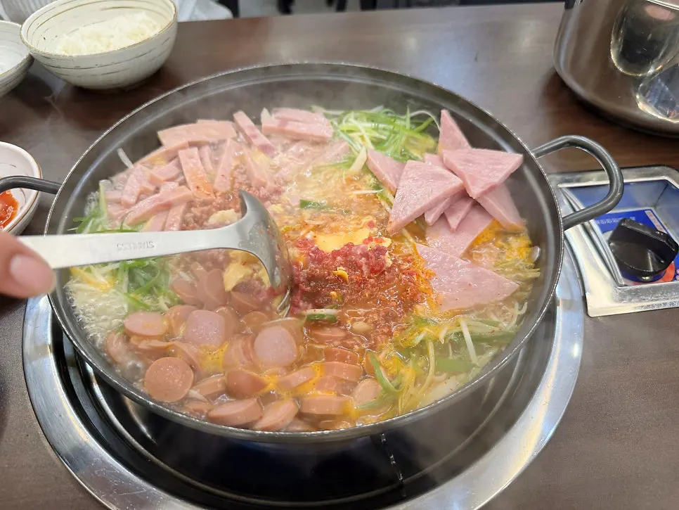 Songtan budae-jjigae for two with ingredients before cooking