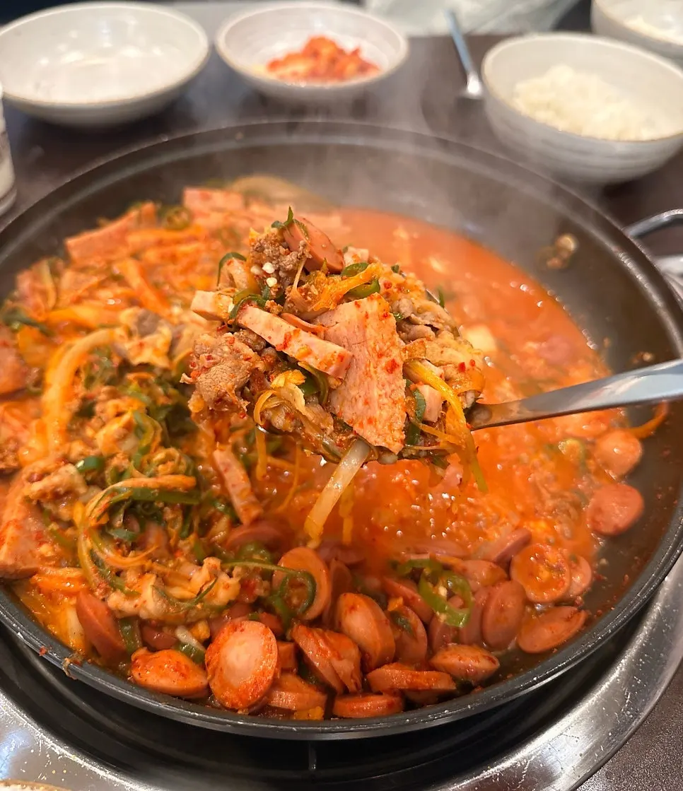 A bowl of budae-jjigae eaten with white rice