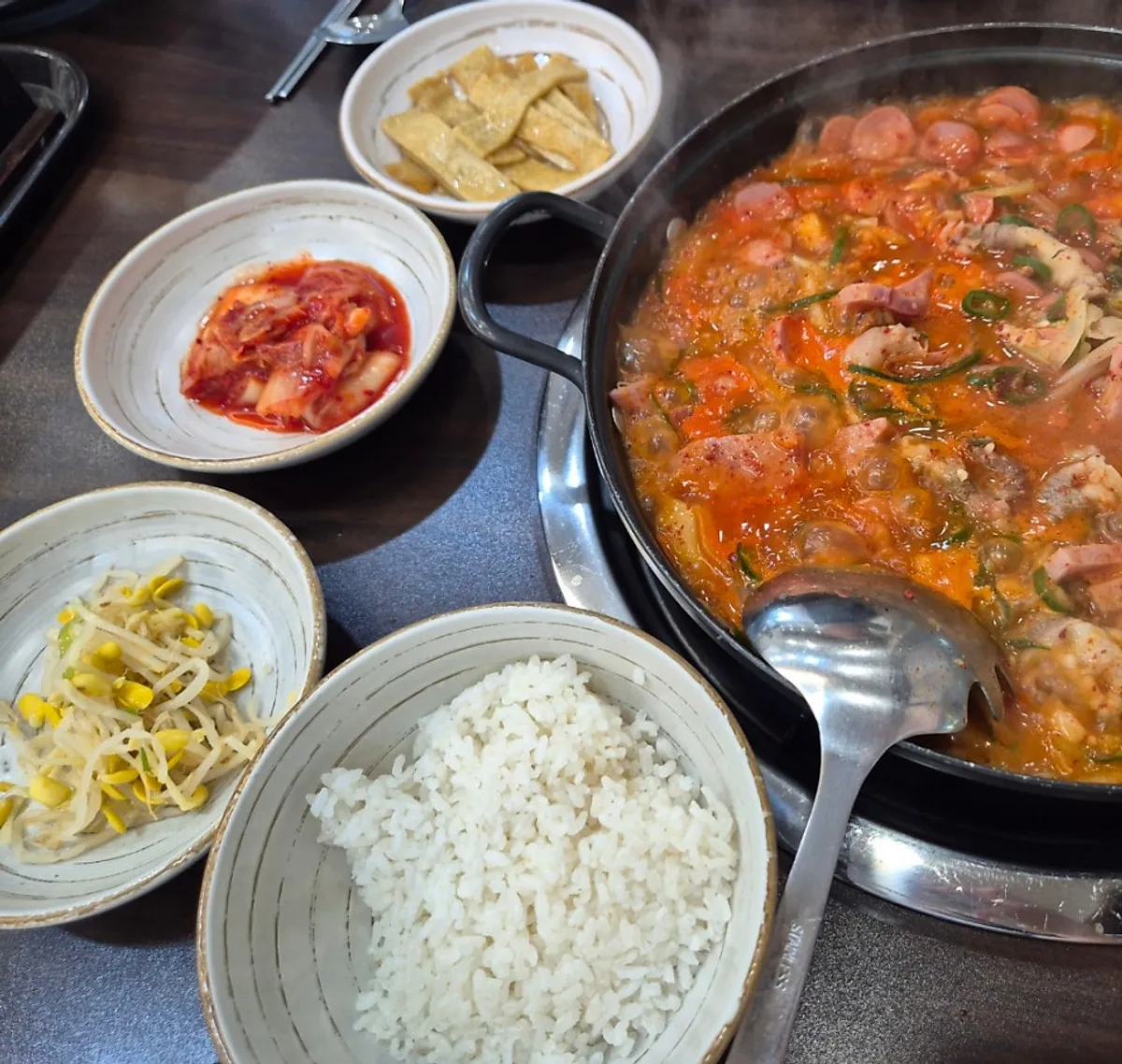 Cheongwon budae-jjigae served with basic side dishes