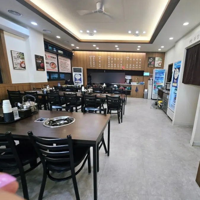 Small, tidy dining hall seating at Cheongwon Restaurant