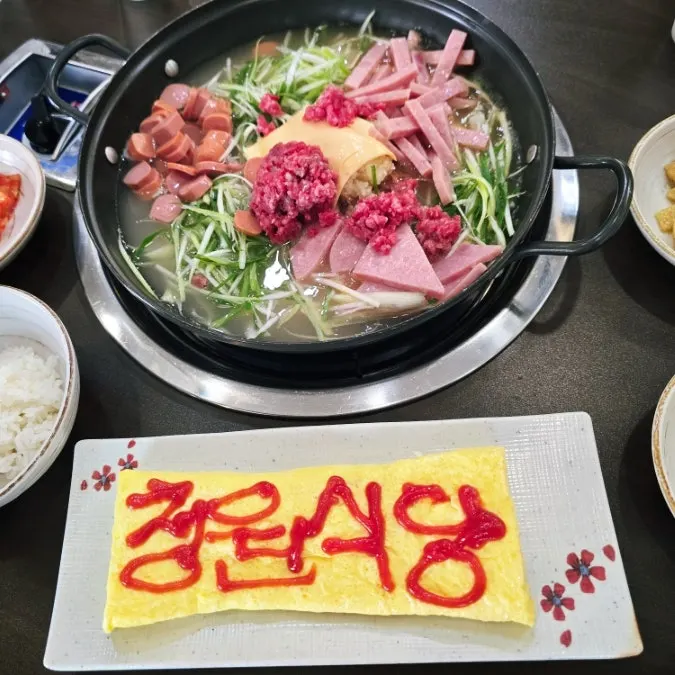 Giant egg roll with ketchup lettering on top