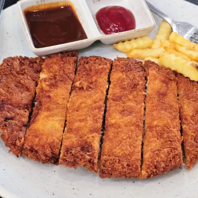 Pork cutlet served with french fries
