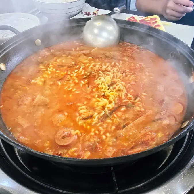 Budae-jjigae boiled again with added ramyeon noodles