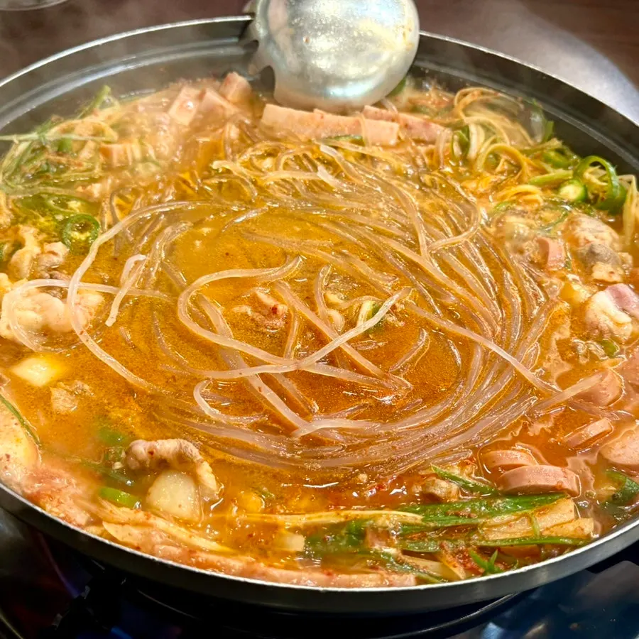 Budae-jjigae with ham, sausage, and added glass noodles