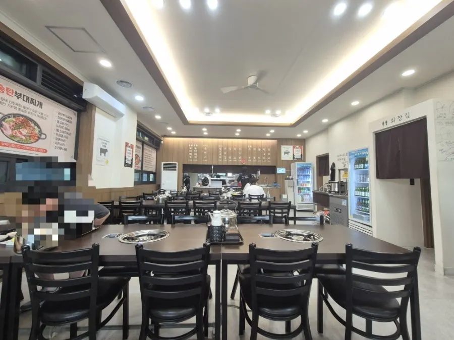 Interior of Cheongwon Restaurant with about 11 tables spaced widely