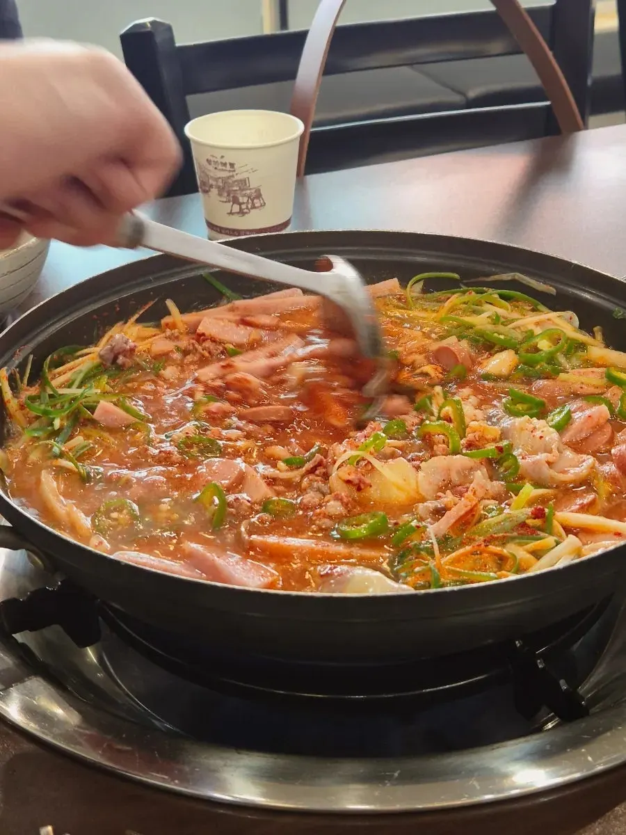 Cheongwon budae-jjigae served in a pot before boiling