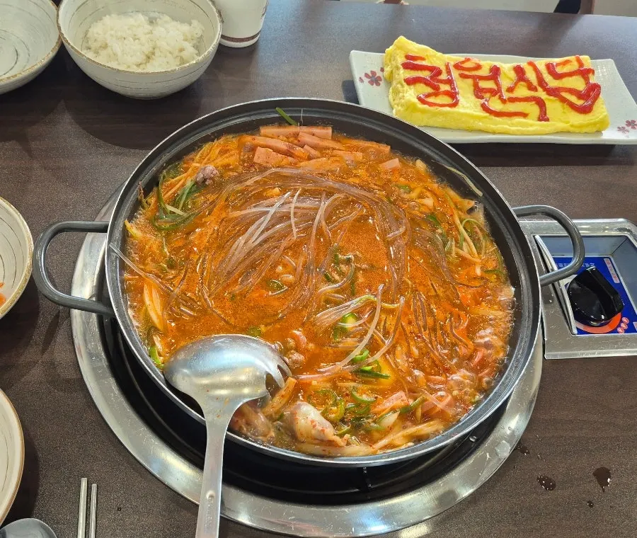 Spicy Cheongwon budae-jjigae loaded with ham and sausage