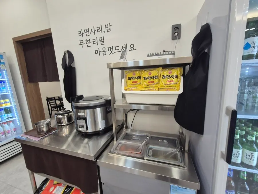 Self-serve side dish counter with kimchi and bean sprouts