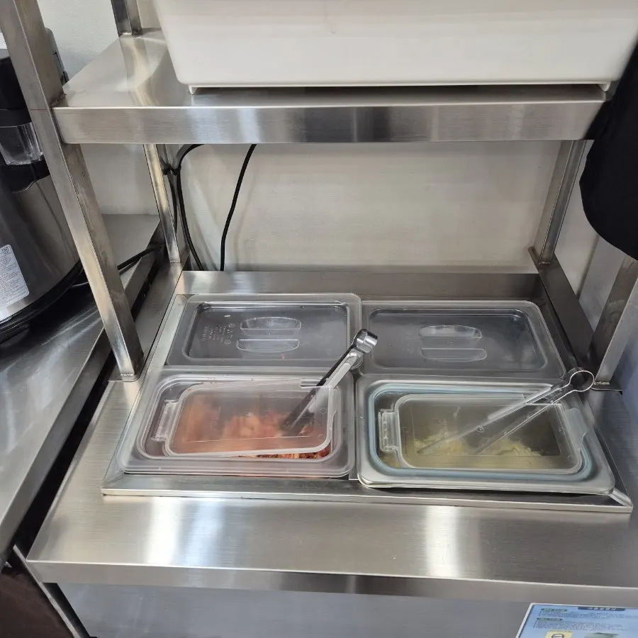 Self-serve counter with unlimited ramen noodles and rice refills