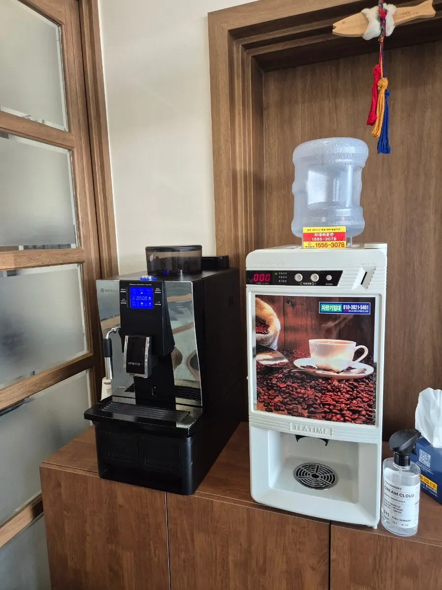 Self-serve coffee machine installed near the exit door